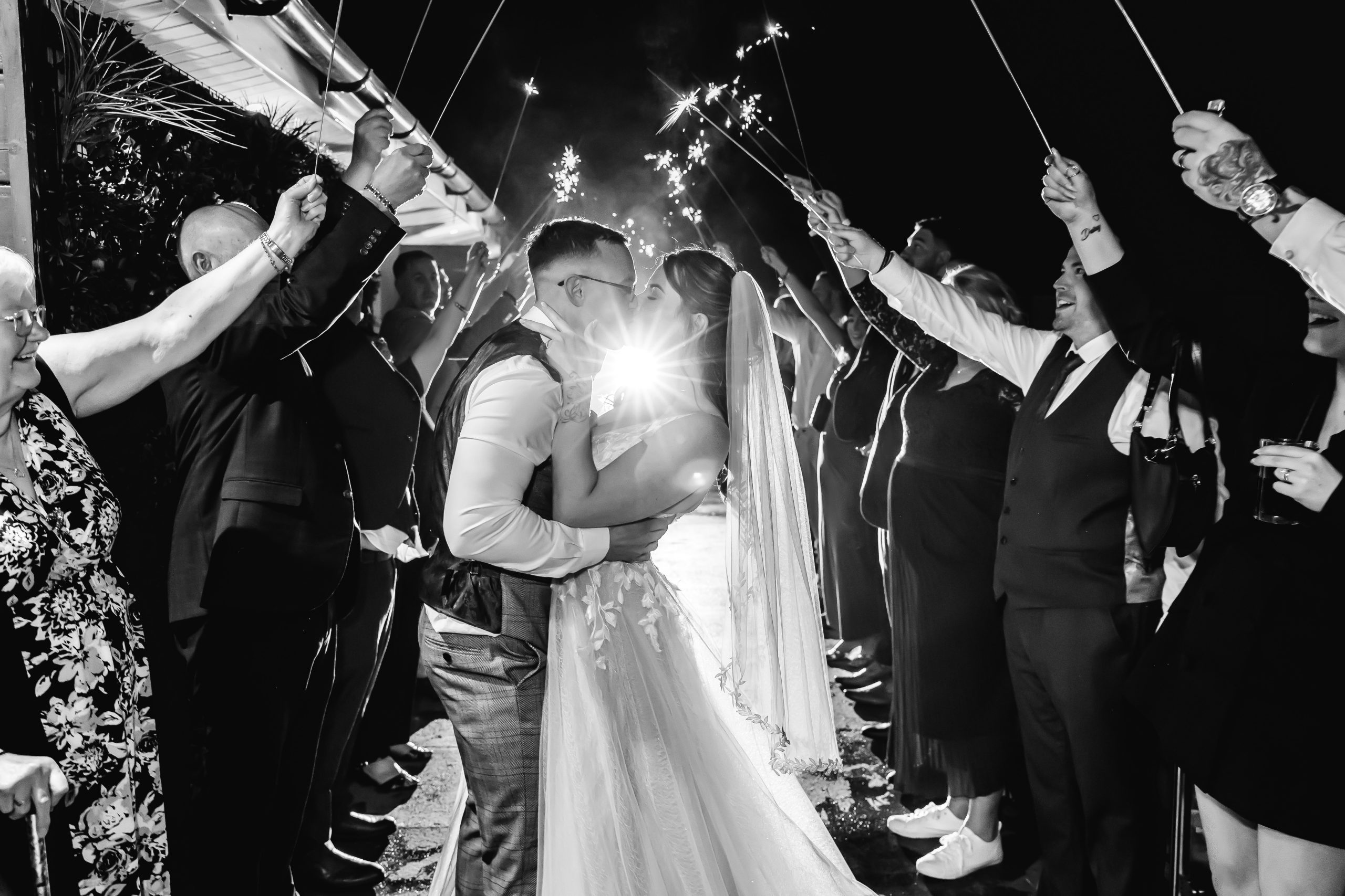 Bride and groom sharing a sparkler exit at their Grimsby wedding photographed by David Cadden Photography