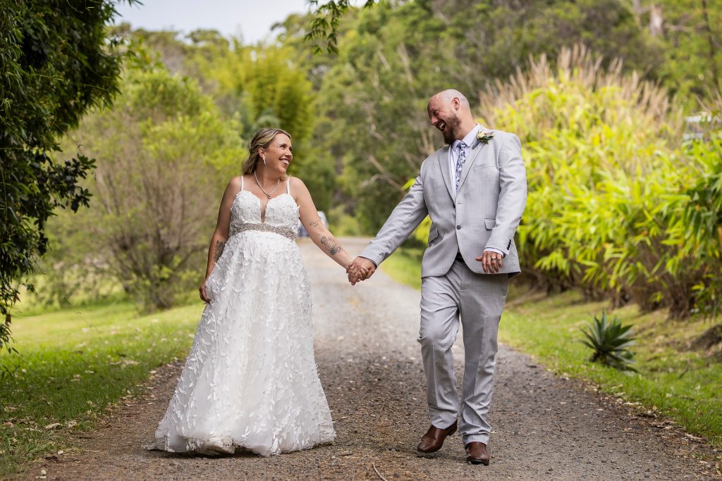 Bride and groom walking together and laughing